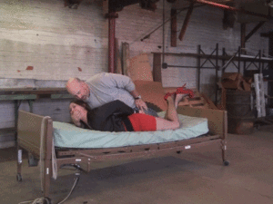 www.jimhunterslair.com - Pushed onto the bed then bound, gagged and painfully hogtied thumbnail