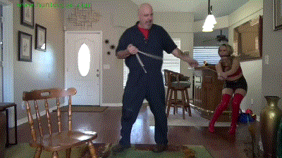 www.jimhunterslair.com - Booted blond bimbo strictly bound to a hard wooden chair thumbnail