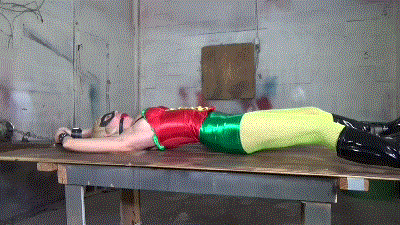 www.jimhunterslair.com - Busty sidekick stretched out on his table for brutal breast bound interrogations thumbnail